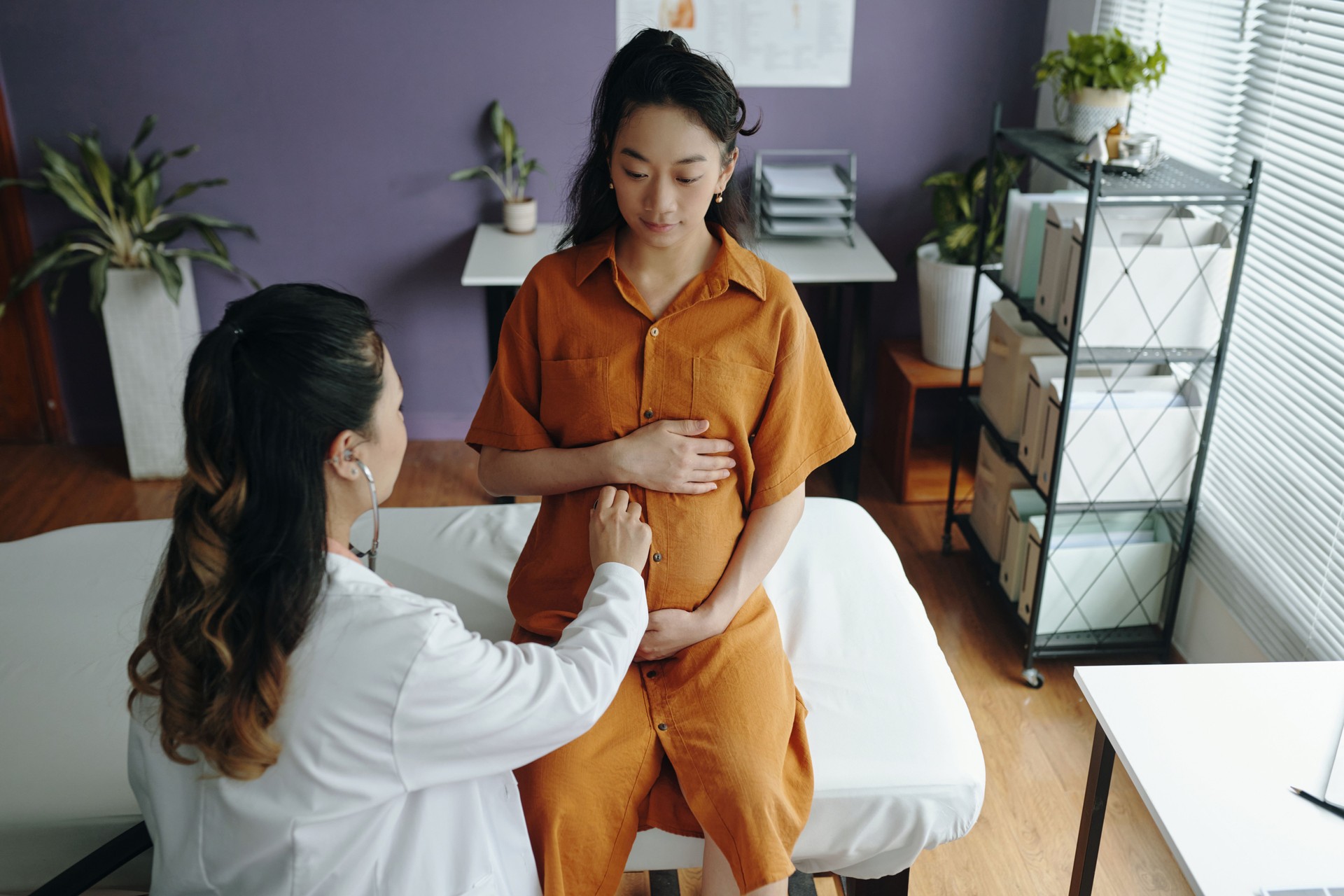 Pregnant Woman Receiving Prenatal Checkup in Clinic